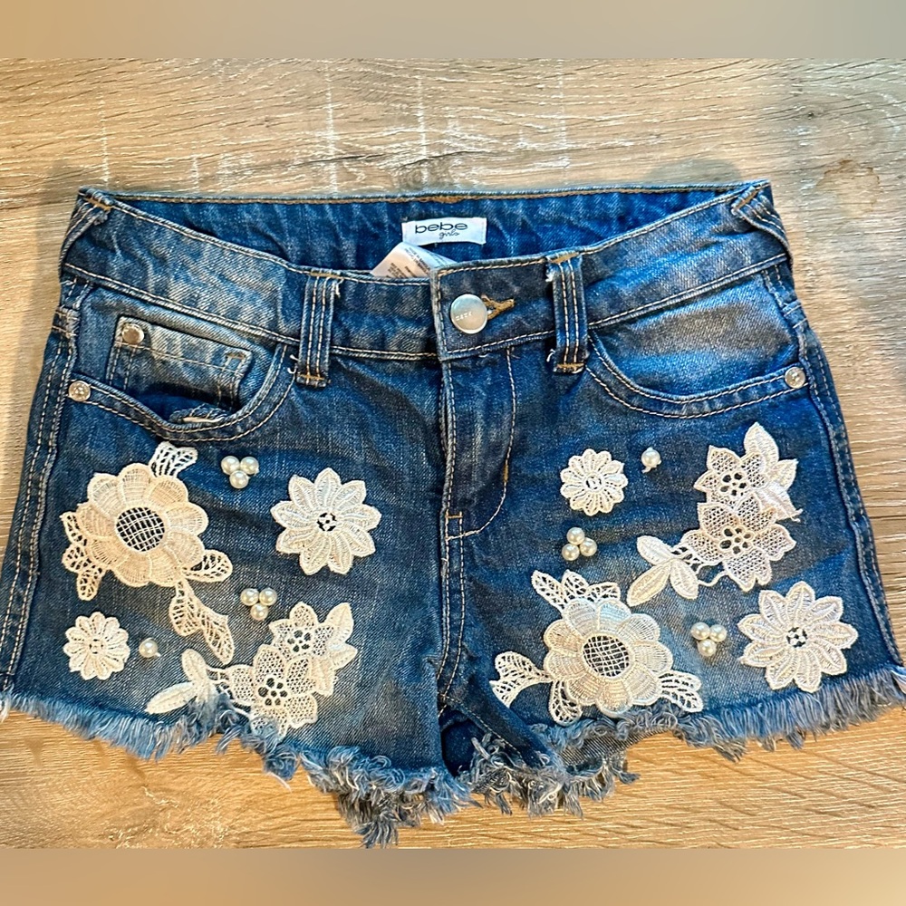 Girls sz 8 denim shorts with lace and faux pearl trim from Bebe